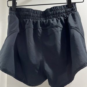 Black athletic Baleaf shorts with zipper pockets, worn once in awhile, size S